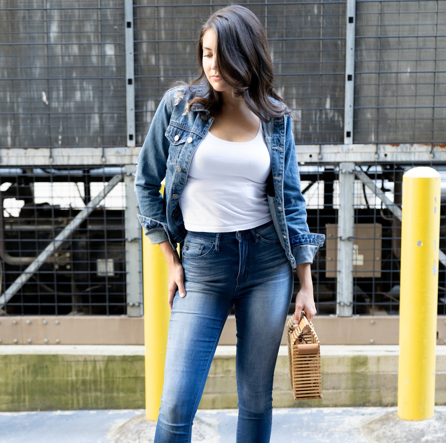 front view of model wearing Distressed Denim Trucker Jacket 