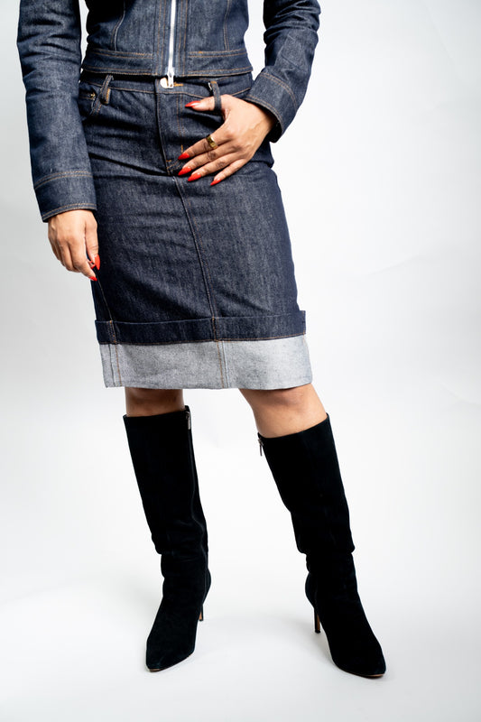 Full-length view of a woman wearing the indigo cuffed-hem denim pencil skirt