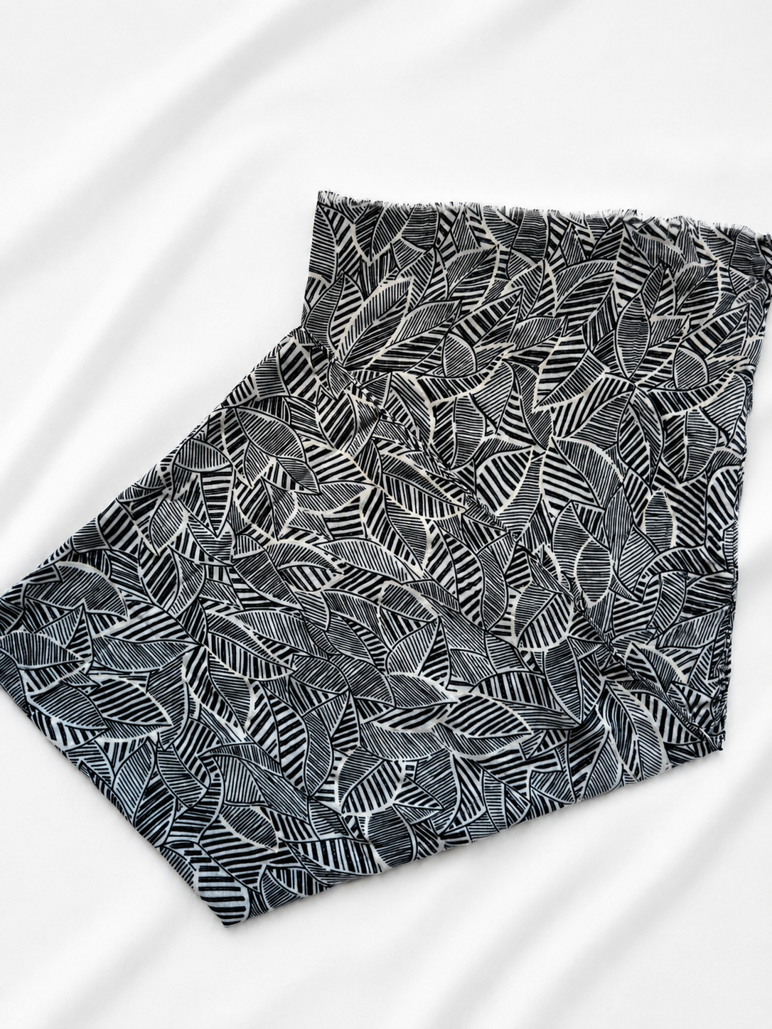 Black and white patterned scarf on a white background