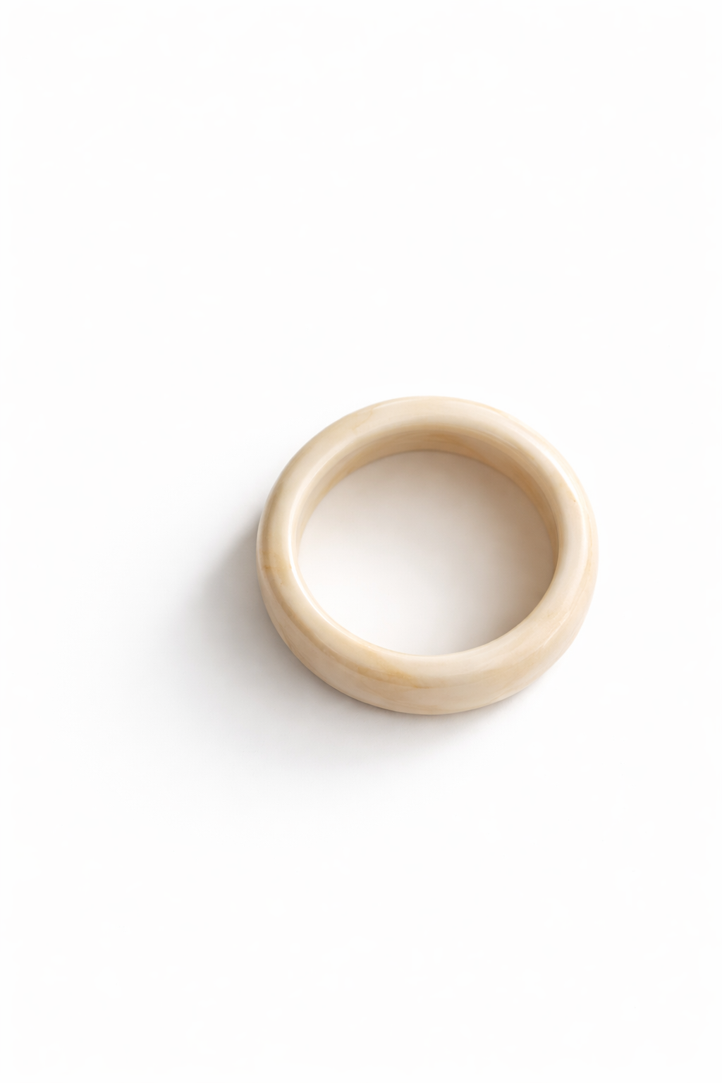 Beige ring on a white background