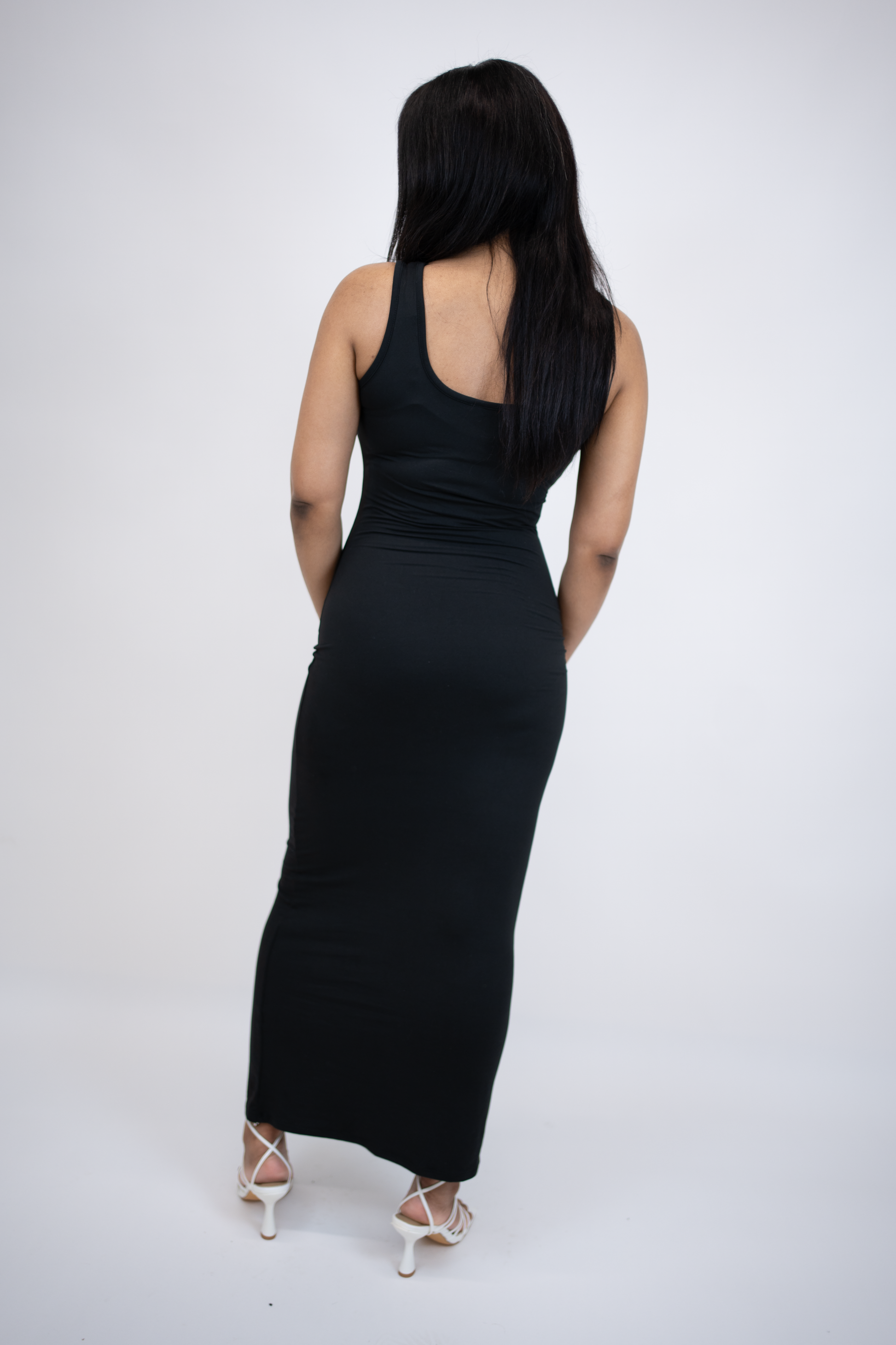 back of fitted black maxi dress